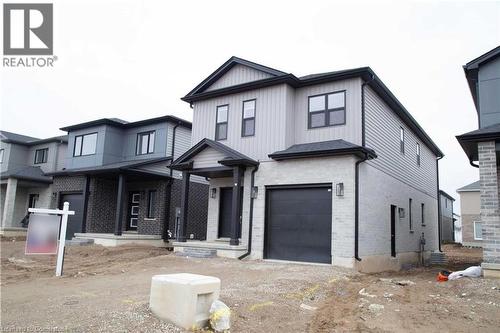 View of front facade with a garage - 182 Byers Street, London, ON - Outdoor With Facade