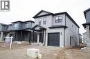 View of front facade with a garage - 182 Byers Street, London, ON  - Outdoor With Facade 