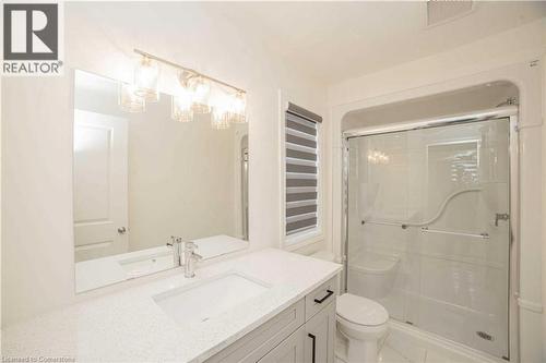 Bathroom with vanity, an enclosed shower, and toilet - 182 Byers Street, London, ON - Indoor Photo Showing Bathroom