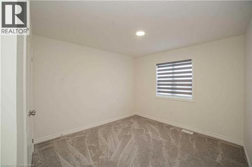 View of carpeted empty room - 182 Byers Street, London, ON - Indoor Photo Showing Other Room