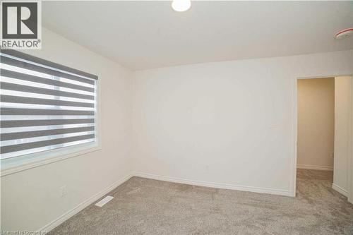 Unfurnished room with plenty of natural light and light colored carpet - 182 Byers Street, London, ON - Indoor Photo Showing Other Room