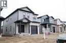 View of front of house with a garage - 182 Byers Street, London, ON  - Outdoor With Facade 