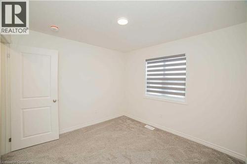 Spare room featuring light carpet - 182 Byers Street, London, ON - Indoor Photo Showing Other Room