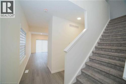 Staircase with hardwood / wood-style floors - 182 Byers Street, London, ON - Indoor Photo Showing Other Room