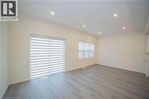 Unfurnished room with hardwood / wood-style floors - 182 Byers Street, London, ON - Indoor Photo Showing Other Room