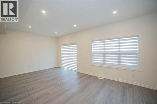 Unfurnished room featuring hardwood / wood-style floors and a healthy amount of sunlight - 182 Byers Street, London, ON - Indoor Photo Showing Other Room