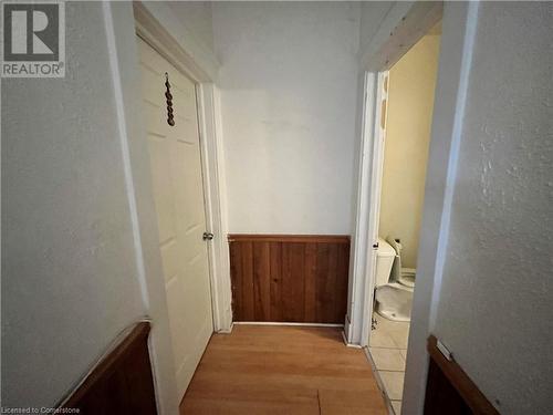 Hall with wood walls and light hardwood / wood-style floors - 744-746 Queen Street S, Kitchener, ON - Indoor Photo Showing Other Room