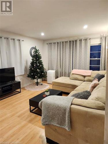 Living room with hardwood / wood-style flooring - 744-746 Queen Street S, Kitchener, ON - Indoor Photo Showing Living Room