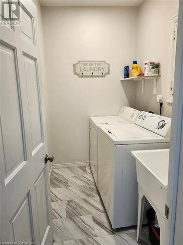 Laundry area featuring separate washer and dryer - 744-746 Queen Street S, Kitchener, ON - Indoor Photo Showing Laundry Room