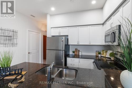 101 - 4700 Highway 7, Vaughan, ON - Indoor Photo Showing Kitchen With Double Sink