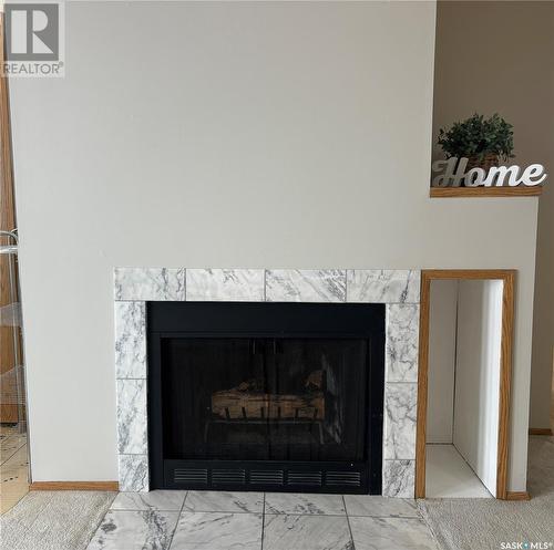 7340 Dalgliesh Drive, Regina, SK - Indoor Photo Showing Living Room With Fireplace