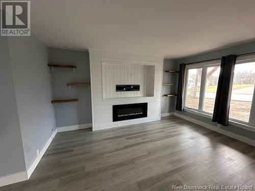 383 Rue Principale Street, Eel River Crossing, NB - Indoor Photo Showing Living Room With Fireplace