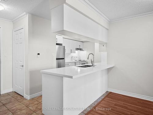 1518-3880 Duke Of York Blvd, Mississauga, ON - Indoor Photo Showing Kitchen With Double Sink