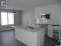 547 Myles Heidt Manor, Saskatoon, SK  - Indoor Photo Showing Kitchen With Double Sink 