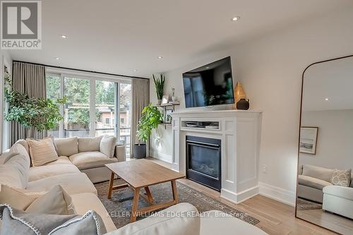 14 Bowsprit Avenue, Toronto, ON - Indoor Photo Showing Living Room With Fireplace