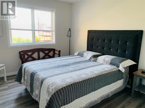 First bedroom - 573 Spruceview Place N, Kelowna, BC - Indoor Photo Showing Bedroom