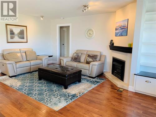 Main floor living room with a fireplace - 573 Spruceview Place N, Kelowna, BC - Indoor Photo Showing Living Room With Fireplace