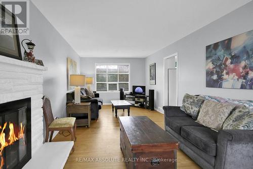 8 Aurora Crescent, Ottawa, ON - Indoor Photo Showing Living Room With Fireplace