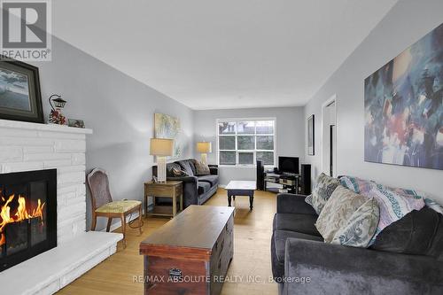 8 Aurora Crescent, Ottawa, ON - Indoor Photo Showing Living Room With Fireplace