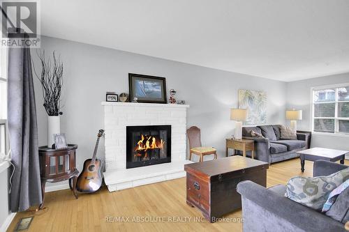 8 Aurora Crescent, Ottawa, ON - Indoor Photo Showing Living Room With Fireplace