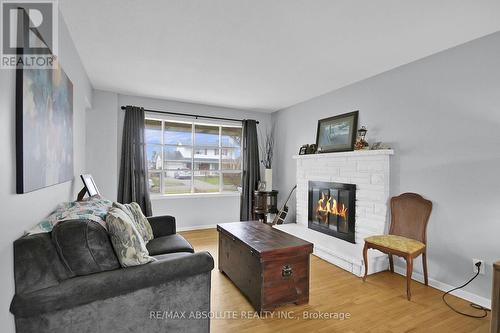 8 Aurora Crescent, Ottawa, ON - Indoor Photo Showing Living Room With Fireplace