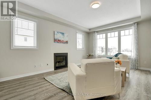 213 Cranesbill Road, Ottawa, ON - Indoor Photo Showing Living Room With Fireplace