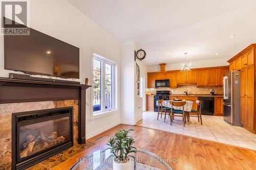 7 - 310 Southbrook Drive, Hamilton, ON - Indoor Photo Showing Living Room With Fireplace