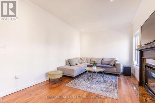 7 - 310 Southbrook Drive, Hamilton, ON - Indoor Photo Showing Living Room With Fireplace