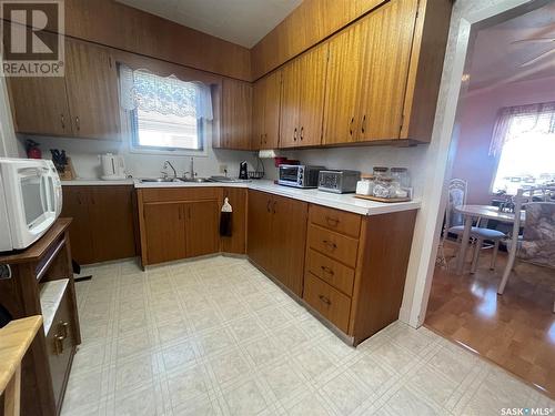 217 Maple Street, Maple Creek, SK - Indoor Photo Showing Kitchen With Double Sink