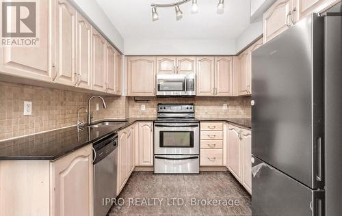 2111 - 4090 Living Arts Drive, Mississauga, ON - Indoor Photo Showing Kitchen With Double Sink