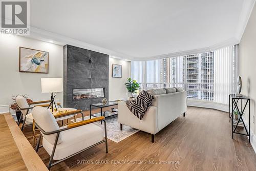 604 - 2170 Marine Drive, Oakville, ON - Indoor Photo Showing Living Room With Fireplace