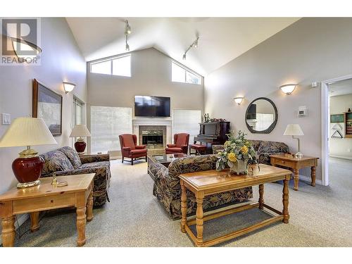 1961 Durnin Road Unit# 305, Kelowna, BC - Indoor Photo Showing Living Room With Fireplace