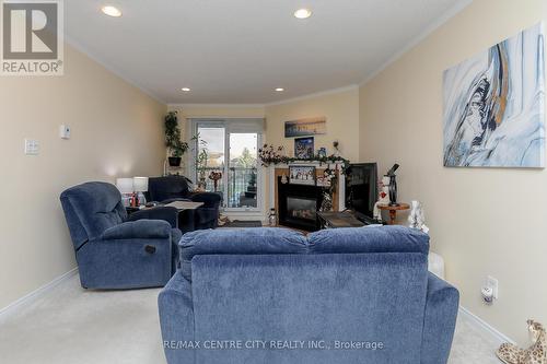 311 - 440 Wellington Street, St. Thomas, ON - Indoor Photo Showing Living Room With Fireplace