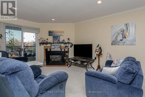 311 - 440 Wellington Street, St. Thomas, ON - Indoor Photo Showing Living Room With Fireplace