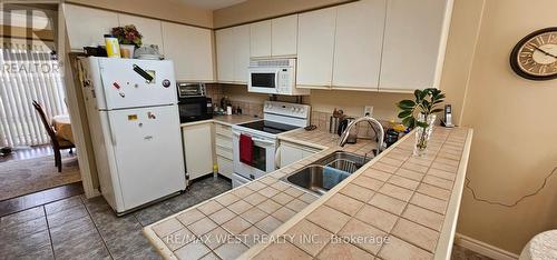 6 - 3600 Colonial Drive, Mississauga, ON - Indoor Photo Showing Kitchen With Double Sink