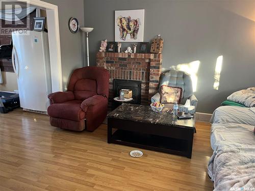 1170 2Nd Avenue Ne, Moose Jaw, SK - Indoor Photo Showing Living Room With Fireplace