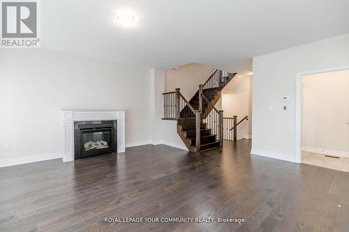 27 Lorne Thomas Place, New Tecumseth, ON - Indoor Photo Showing Living Room With Fireplace