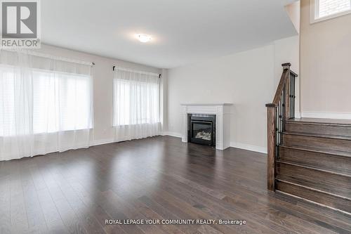 27 Lorne Thomas Place, New Tecumseth, ON - Indoor Photo Showing Living Room With Fireplace