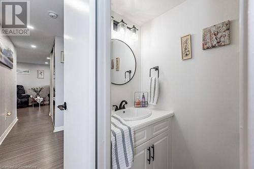 Bathroom featuring vanity and wood-type flooring - 3100 Kirwin Avenue Unit# 2102, Mississauga, ON - Indoor