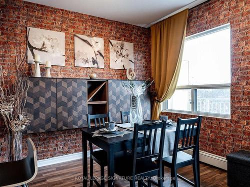 404-60 Gulliver Rd N, Toronto, ON - Indoor Photo Showing Dining Room With Fireplace