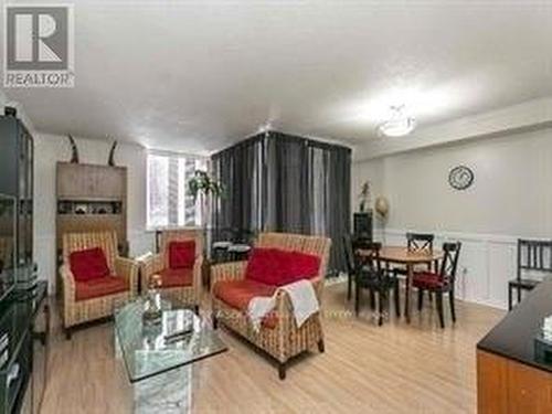 107 - 2500 Bridletowne Circle, Toronto, ON - Indoor Photo Showing Living Room