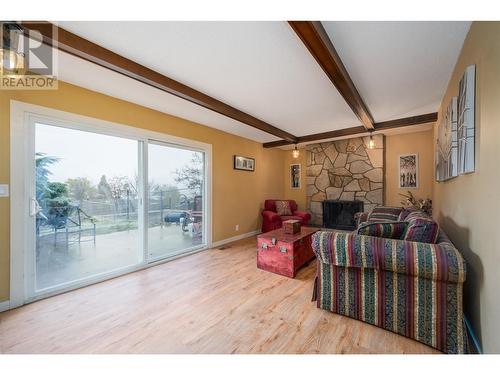 Direct access to backyard! - 2308 Thacker Drive, West Kelowna, BC - Indoor With Fireplace