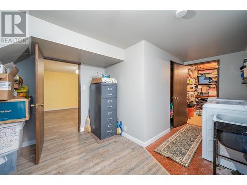 Laundry room with attached storage room - 2308 Thacker Drive, West Kelowna, BC - Indoor