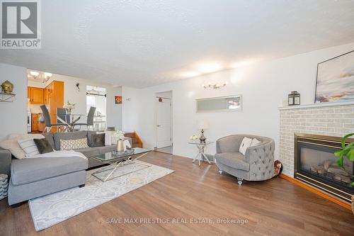 84 Wimbleton Crescent, Kitchener, ON - Indoor Photo Showing Living Room With Fireplace