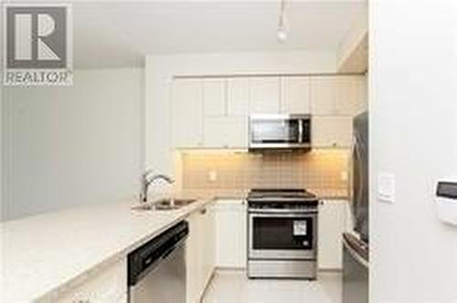 309 - 39 Annie Craig Drive, Toronto, ON - Indoor Photo Showing Kitchen With Upgraded Kitchen