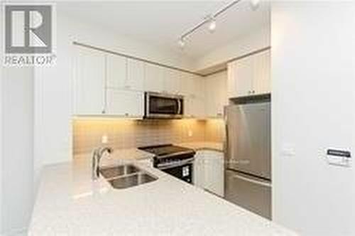 309 - 39 Annie Craig Drive, Toronto, ON - Indoor Photo Showing Kitchen With Double Sink