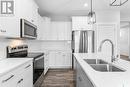 77 900 St Andrews Lane, Warman, SK  - Indoor Photo Showing Kitchen With Double Sink With Upgraded Kitchen 