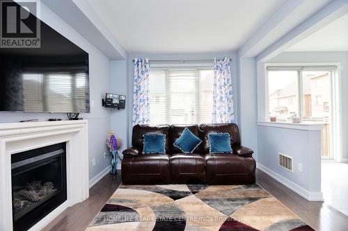 11 Villadowns Trail, Brampton, ON - Indoor Photo Showing Living Room With Fireplace