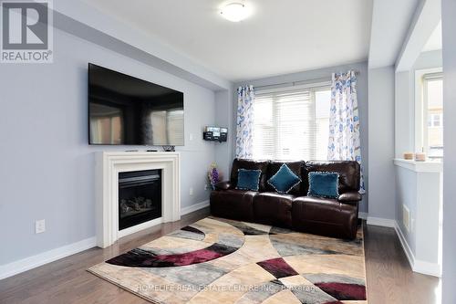 11 Villadowns Trail, Brampton, ON - Indoor Photo Showing Living Room With Fireplace