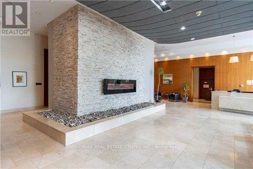 2402 - 220 Burnhamthorpe Road W, Mississauga, ON - Indoor With Fireplace